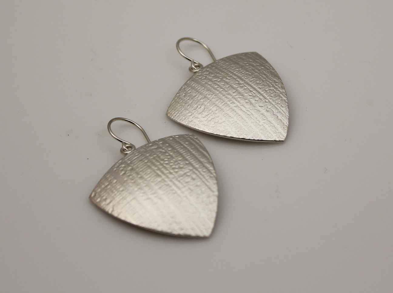 Trillion Canvas Texture Earrings in Sterling Silver.
