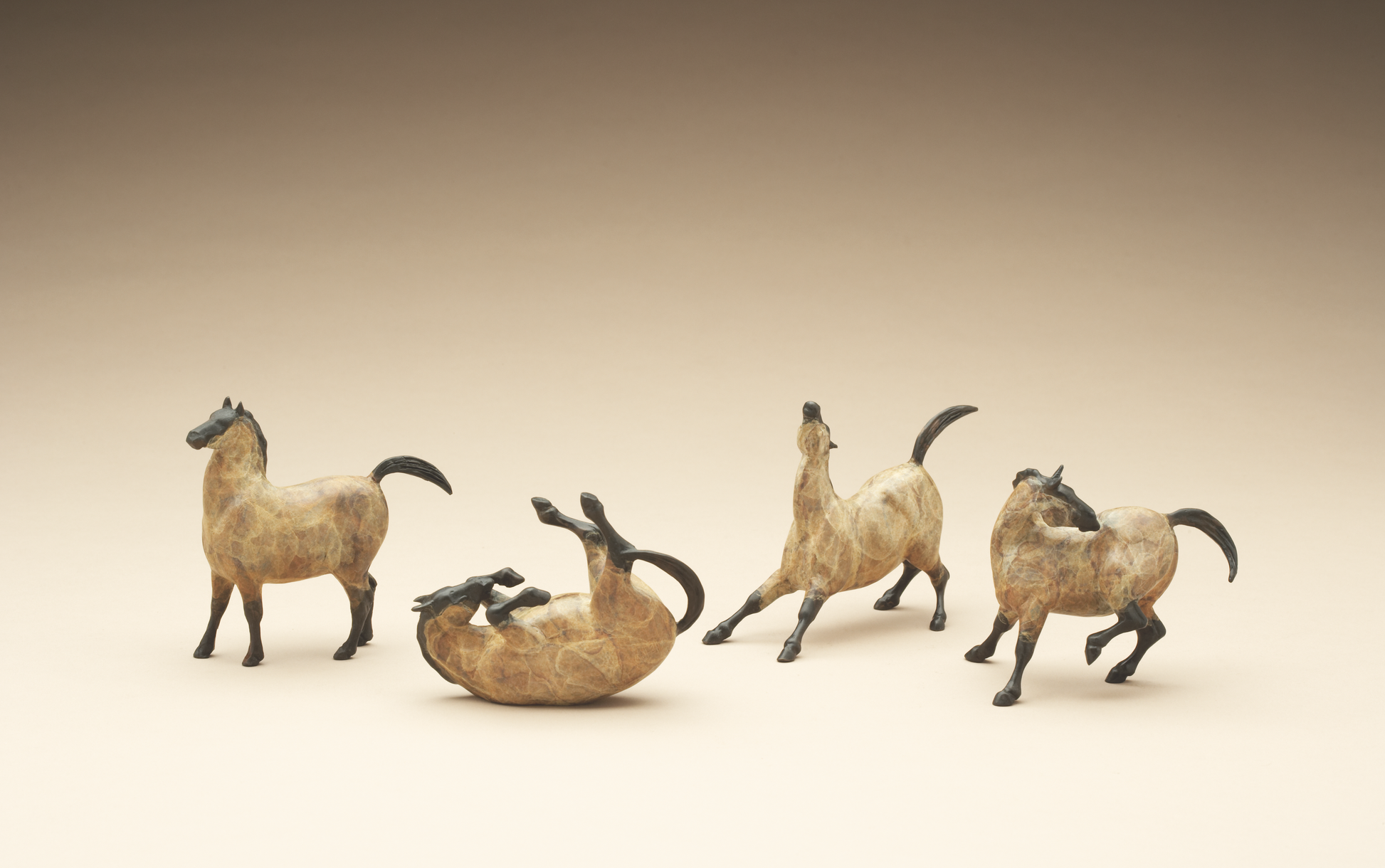 four bronze mini horses