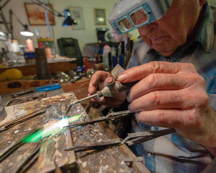Jeweler Ben Nighthorse in his studio. Featured Santa Fe Art Gallery jewelry artist.
