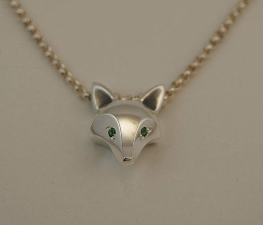 Fox Head pendant. About Dime Sized made from Bronze, Sterling Silver with a Satin or High Polish Finish. Gemstone Eyes - lots of colors available. Jewelry by Sculpture artist Michael Tatom at Sorrel Sky Gallery. Fox Jewelry.