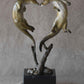 Bronze Sculpture of 2 playful Otters by Jim Eppler. 