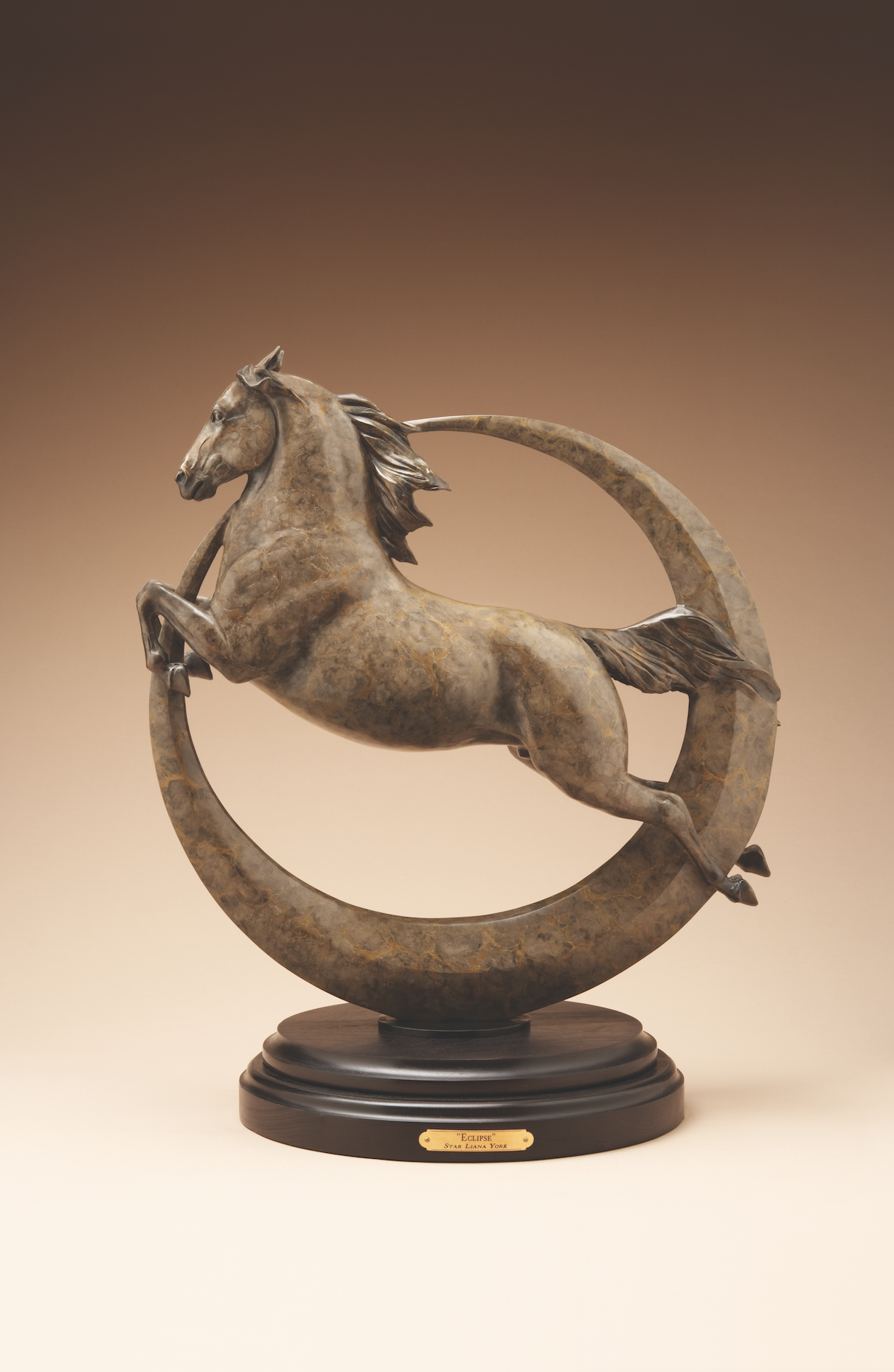 Bronze sculpture of a leaping horse and moon eclipse