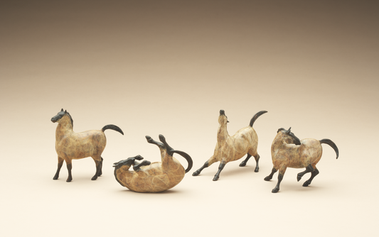 four bronze mini horses 
