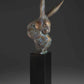 A Rabbit bust on a black pedestal. Sculpture Bronze by Tim Cherry. Sorrel Sky Gallery