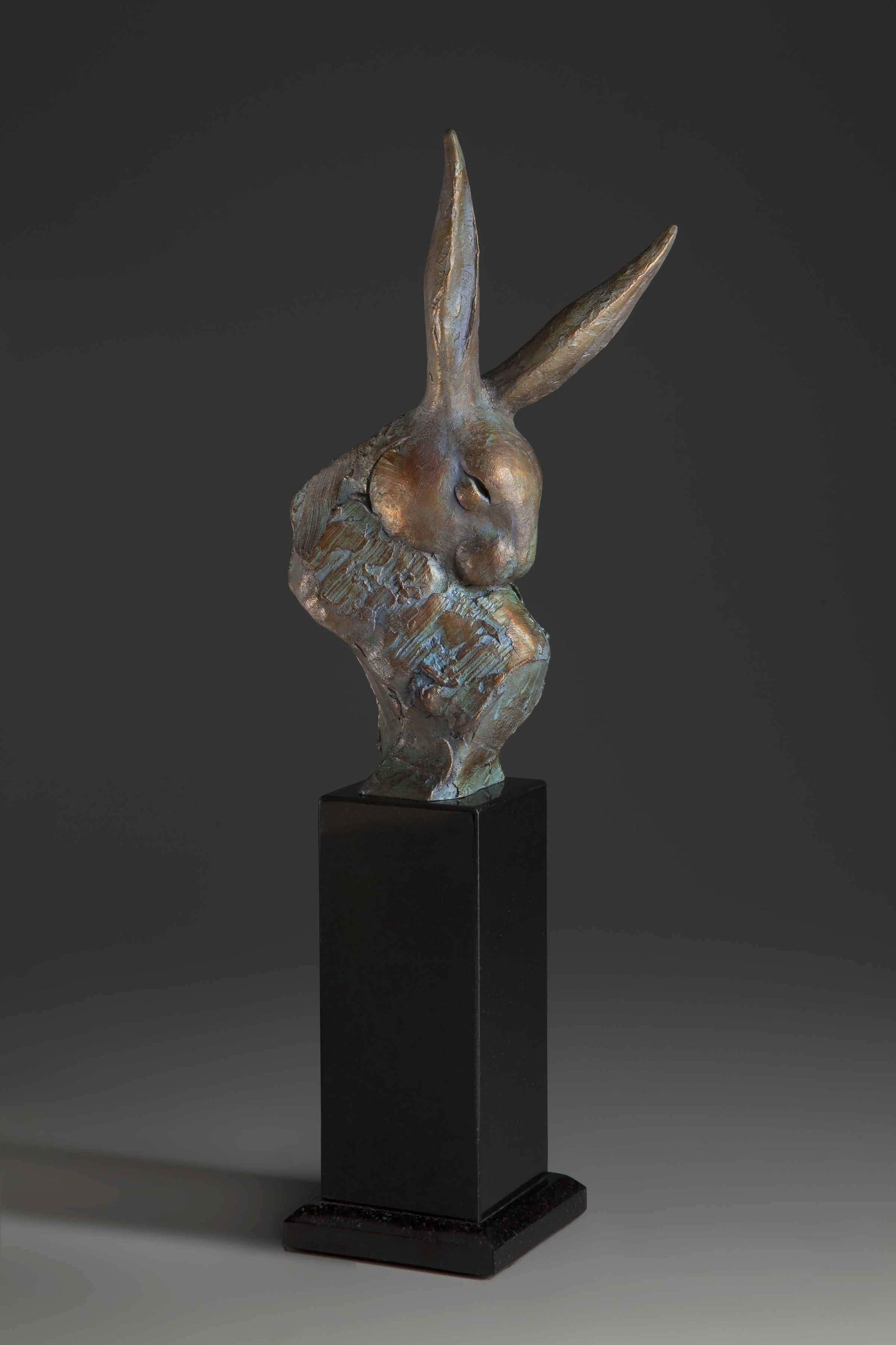 A Rabbit bust on a black pedestal. Sculpture Bronze by Tim Cherry. Sorrel Sky Gallery
